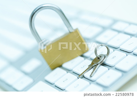 Security lock on white computer keyboard Security lock on white computer keyboard 22580978