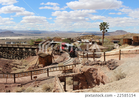 A steam locomotive running in a ghost town of a waste pit trace America A steam locomotive running in a ghost town of a waste pit trace America 22585154