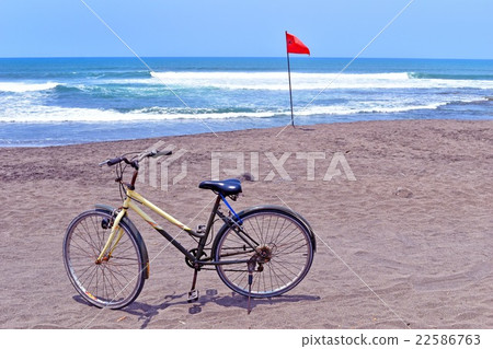 Bicycle parked on the beach Bicycle parked on the beach 22586763