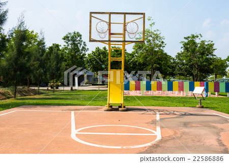 Outdoor basketball court with two hoops 22586886