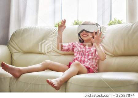 girl playing game in virtual reality glasses 22587874