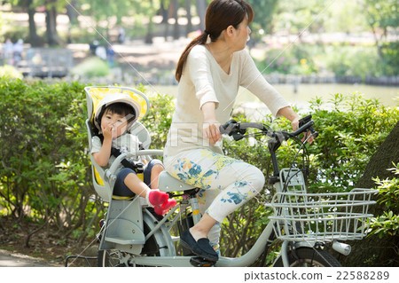Parents riding a bicycle Parents riding a bicycle 22588289
