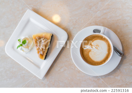Cup of coffee and cheesecake piece Cup of coffee and cheesecake piece 22591316
