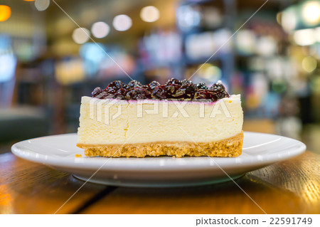 Slice of blueberry cheesecake 22591749