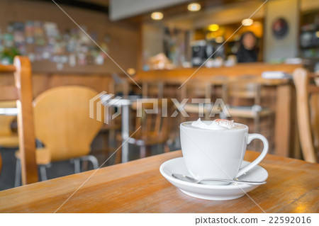 Coffee cup on table in cafe 22592016