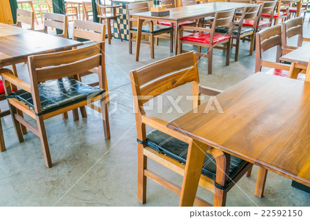 Tables and chairs in restaurant Tables and chairs in restaurant 22592150