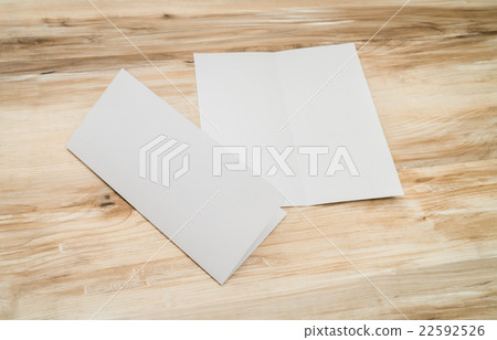 Bifold white template paper on wood texture 22592526