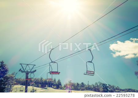 Sunset and Ski lift going over the mountain ( Filtered image processed vintage effect. ) 22593278