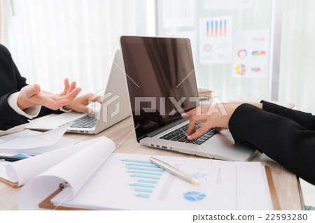 Business people using laptop and Financial charts at meeting office 22593280