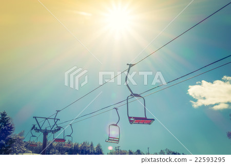 Sunset and Ski lift going over the mountain ( Filtered image processed vintage effect. ) Sunset and Ski lift going over the mountain ( Filtered image processed vintage effect. ) 22593295