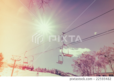 Sunset and Ski lift going over the mountain ( Filtered image processed vintage effect. ) Sunset and Ski lift going over the mountain ( Filtered image processed vintage effect. ) 22593482