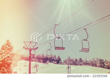 Sunset and Ski lift going over the mountain ( Filtered image processed vintage effect. ) Sunset and Ski lift going over the mountain ( Filtered image processed vintage effect. ) 22593506