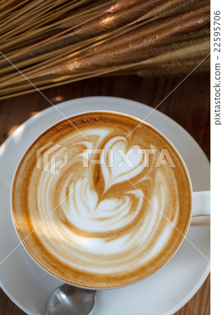 Cup of latte coffee on wooden table 22595706