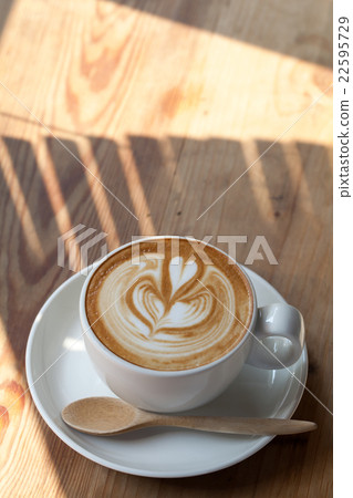 A cup of coffee latte and light breakfast A cup of coffee latte and light breakfast 22595729