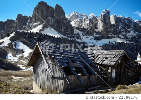 Alpine meadow with old wooden farmhouse. 22599176