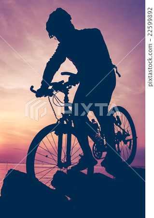 Healthy. Silhouette of bicyclist riding the bike Healthy. Silhouette of bicyclist riding the bike 22599892