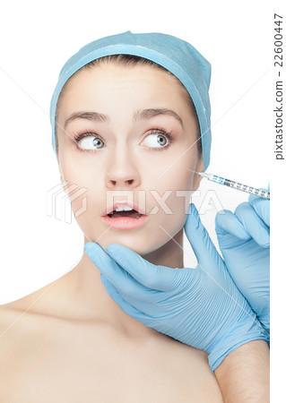 Attractive woman at plastic surgery with syringe Attractive woman at plastic surgery with syringe 22600447