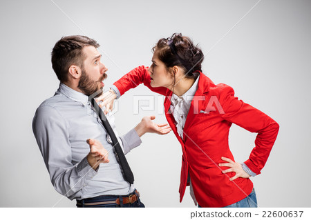 The angry business man and woman conflicting on a The angry business man and woman conflicting on a 22600637
