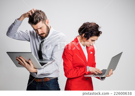 The young businessman and businesswoman with The young businessman and businesswoman with 22600638