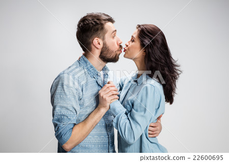 Portrait of happy couple on gray background 22600695