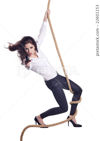 Young woman holding a gun 22601153