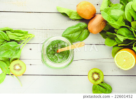 green detox smoothie with spinach in a jar, kiwi green detox smoothie with spinach in a jar, kiwi 22601452
