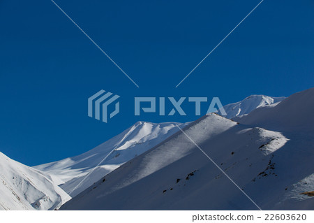 Beautiful blue skies with clouds over the mountain 22603620