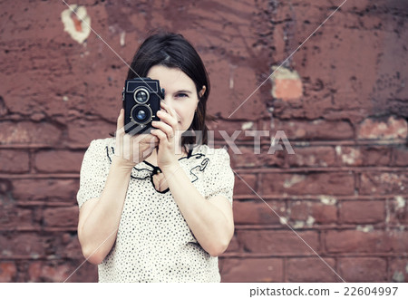 Girl taking photo 22604997