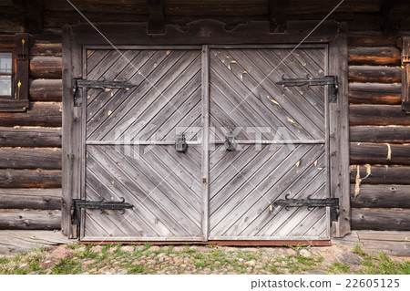 Closed gate in old wooden wall Closed gate in old wooden wall 22605125