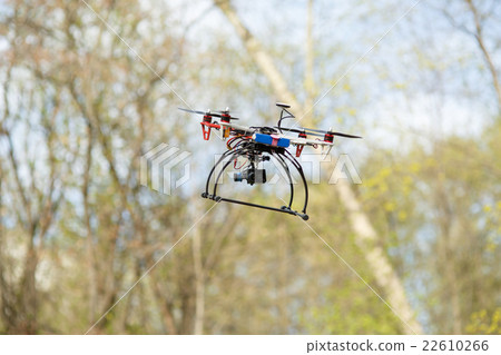 Drone flying in forest 22610266