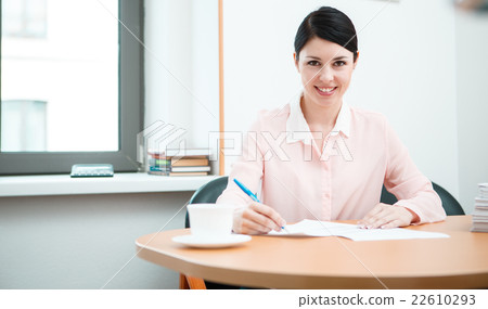 wonam work with papers in office room. wonam work with papers in office room. 22610293