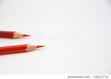 Two red colored pencils on white background 22612718