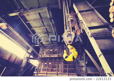 Vintage toned crane hook in abandoned coal mine. 22613133