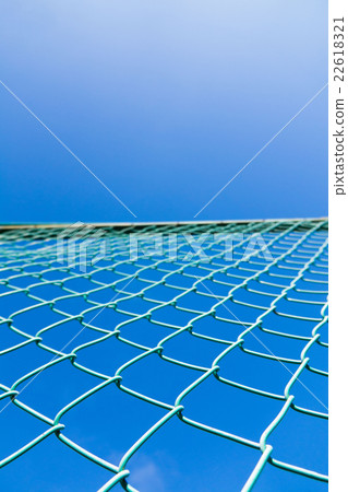 Wire mesh and blue sky Wire mesh and blue sky 22618321