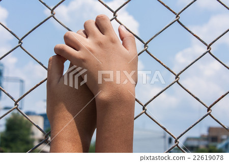 asian girl hand hold jail asian girl hand hold jail 22619078
