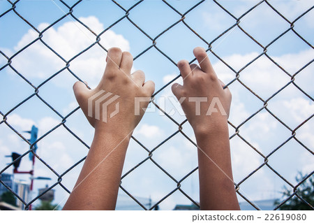 asian girl hand hold jail asian girl hand hold jail 22619080