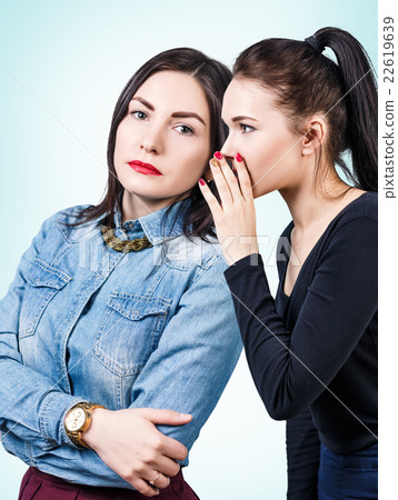 Young girls gossiping some secret 22619639