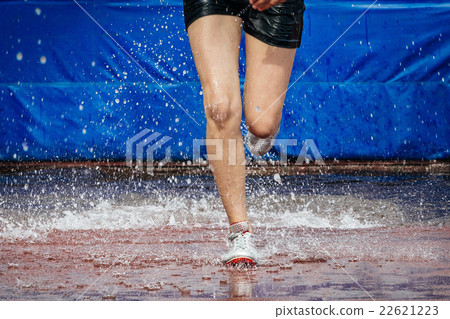 girl athlete foot running steeplechase girl athlete foot running steeplechase 22621223