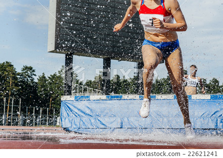 woman athlete runs steeplechase 22621241
