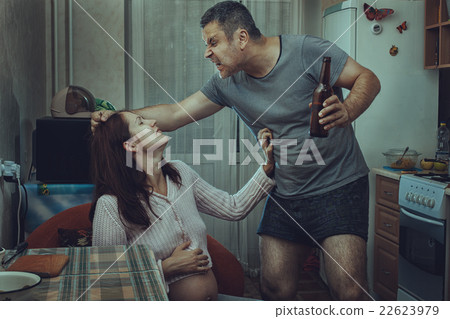 Alcoholic husband beats his wife. 22623979