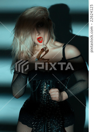 Woman with a thick cigar. Woman with a thick cigar. 22624125