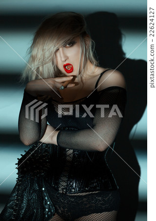 Vulgar woman smoking a fat cigar. Vulgar woman smoking a fat cigar. 22624127
