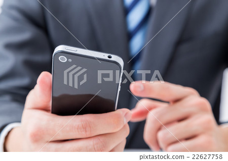 Handjob with smartphone male employee businessman business image investment side job 22627758