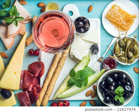 Summer wine snack set. Glass of rose, meat, cheese Summer wine snack set. Glass of rose, meat, cheese 22627874
