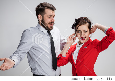 The business man and woman communicating on a gray 22629113
