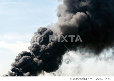 lot of black smoke from the fire 22629650