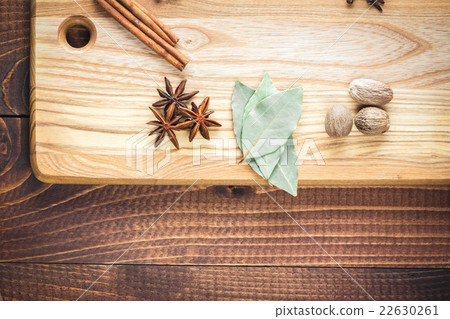 Beautiful colorful spices on bright kitchen Board  22630261