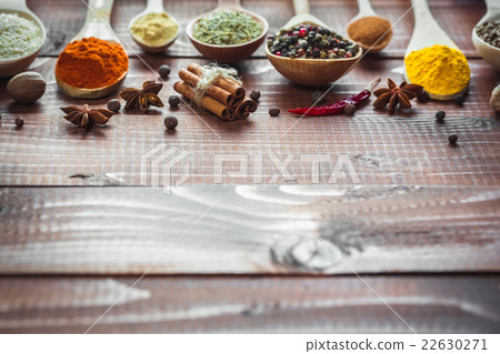 Beautiful colorful spices in wooden spoons  22630271