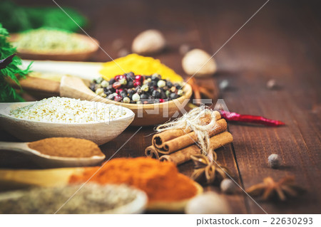 Beautiful colorful spices in wooden spoons 22630293