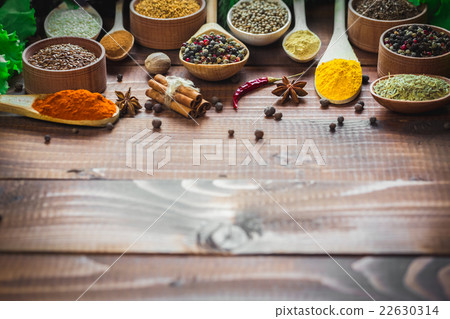 Beautiful colorful spices in wooden spoons Beautiful colorful spices in wooden spoons 22630314